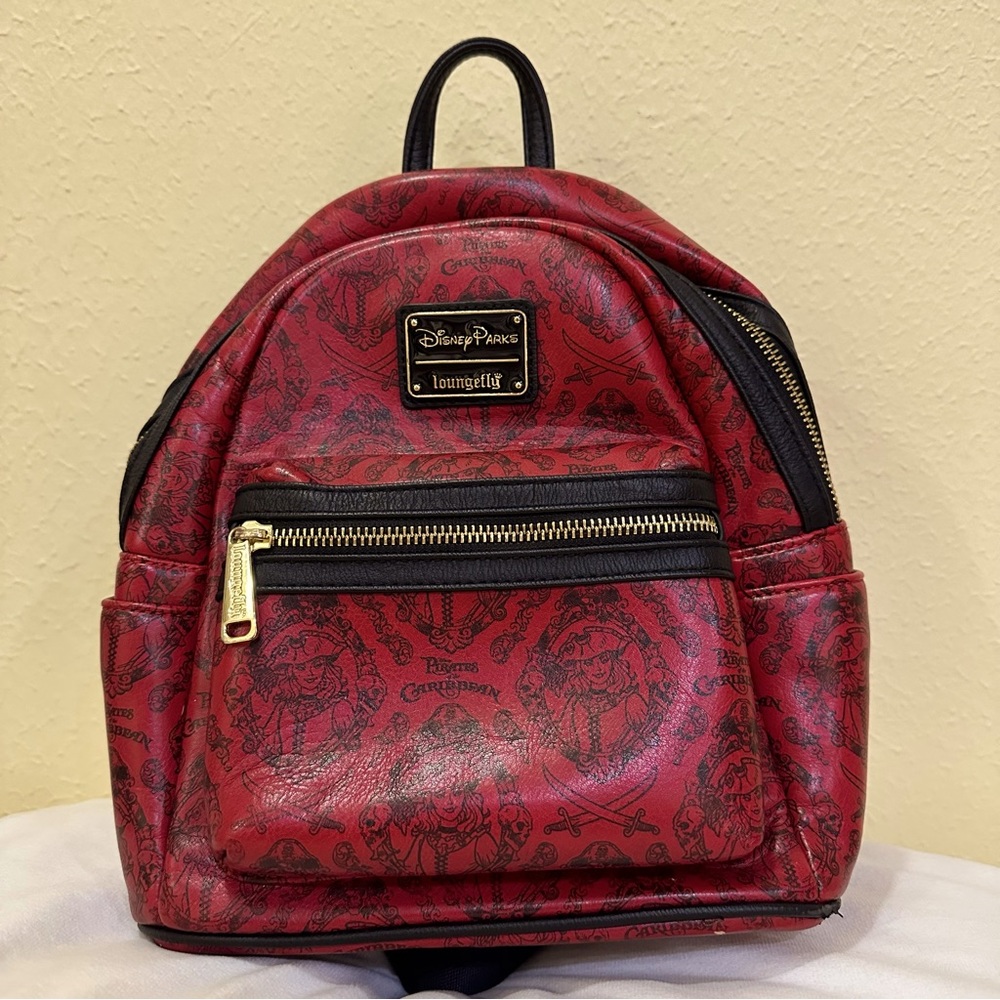 Disney Parks Loungefly Pirates of the Caribbean red and black mini backpack.